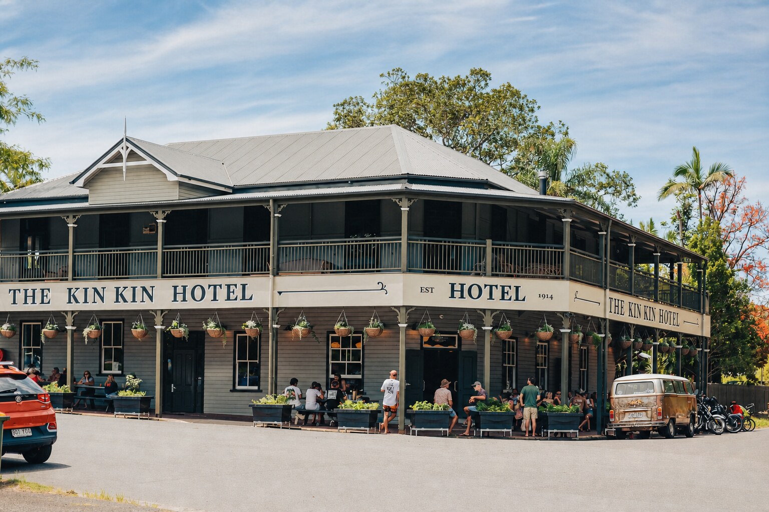 The historic Kin Kin Hotel and people gathering in the village